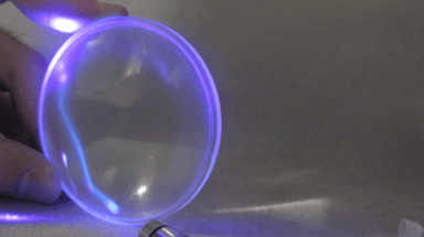 A Laser Being Redirected Through An Acrylic Plastic Lens